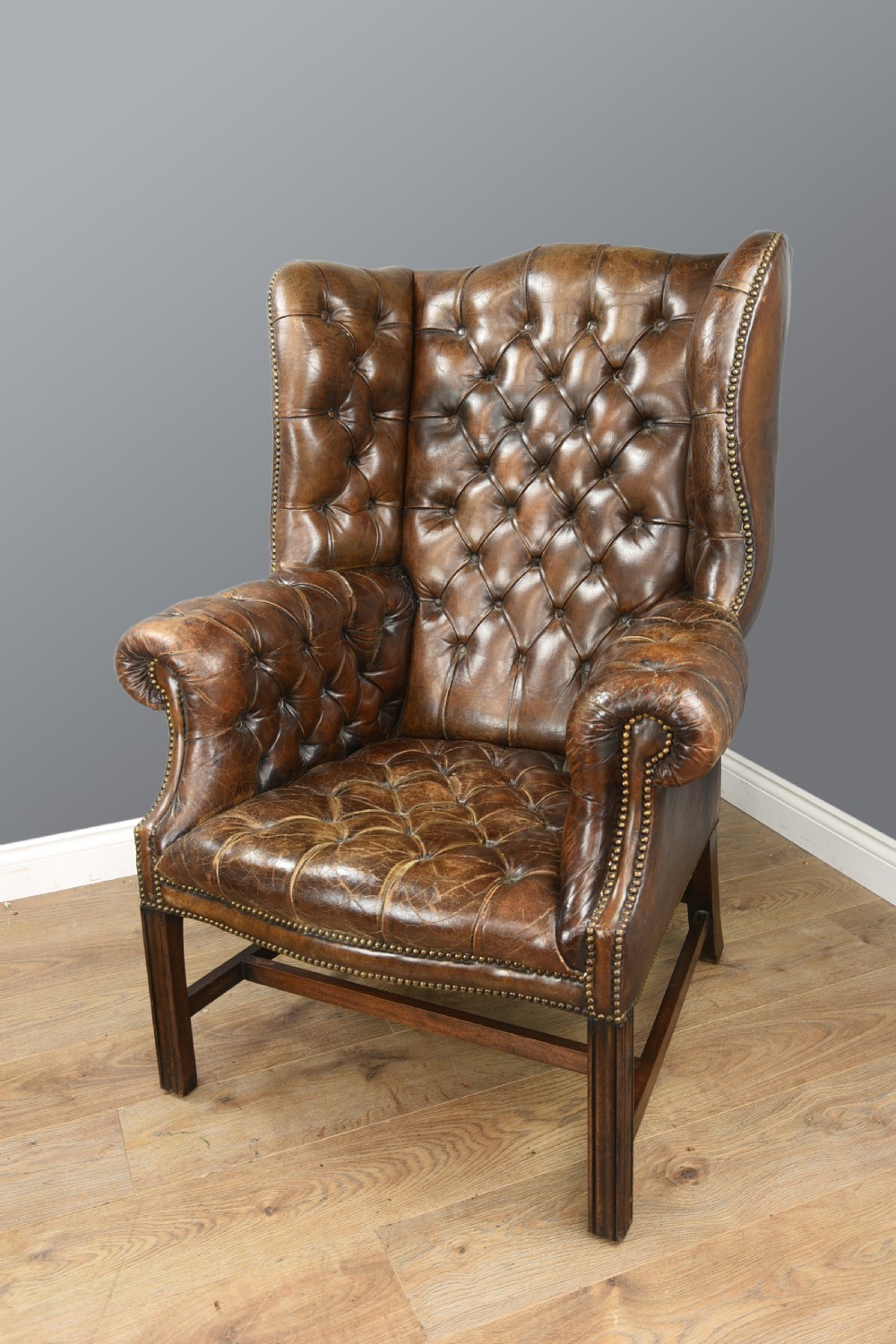 Antique leather wing chair 