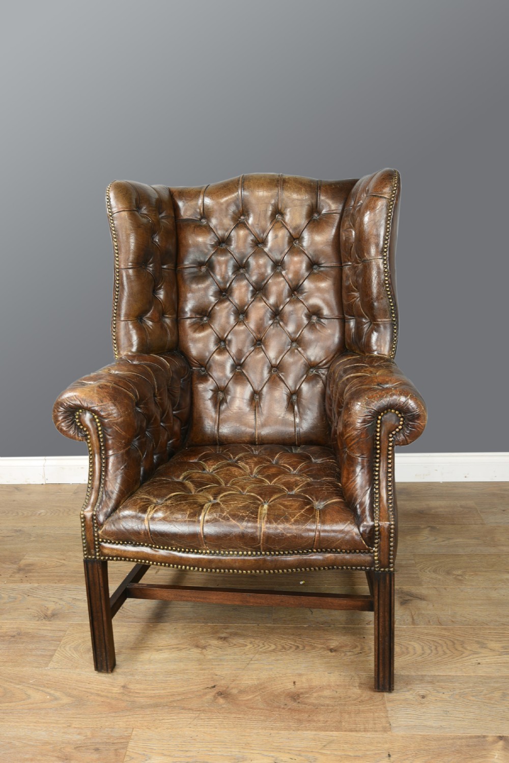 Antique leather wing chair  View II