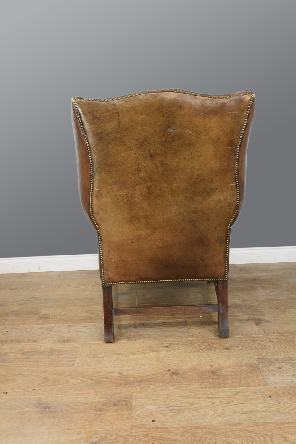 Antique leather wing chair  View V