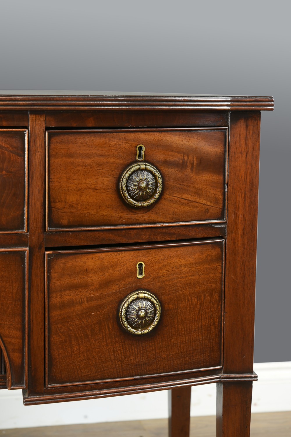 Small Georgian mahogany bow front sideboard  View II