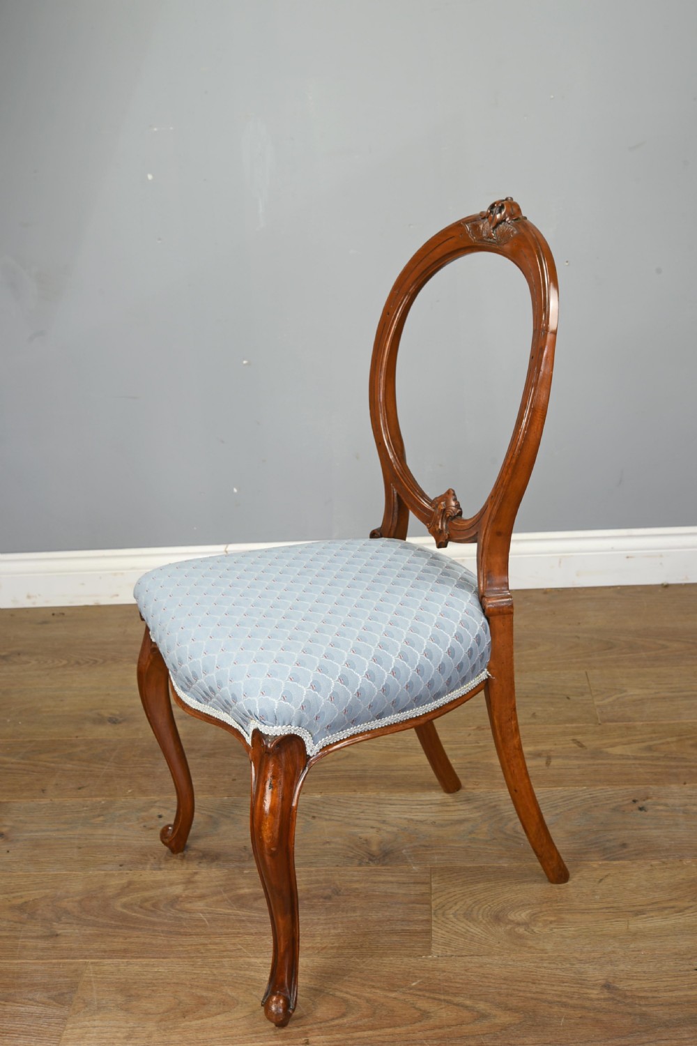 set of six Victorian walnut balloon back chairs  View IV