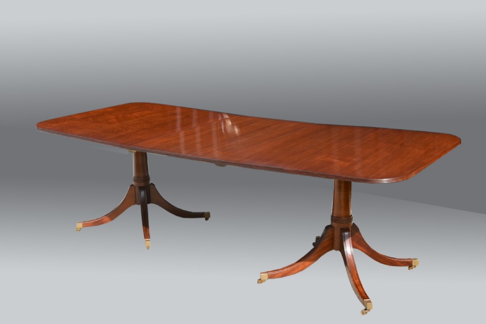 Antique Regency style extending twin pillar dining table 