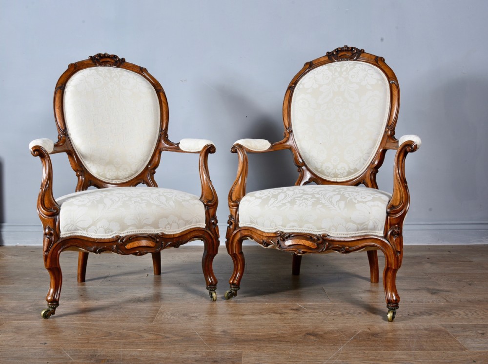 Fine pair of Victorian walnut open arm chairs 