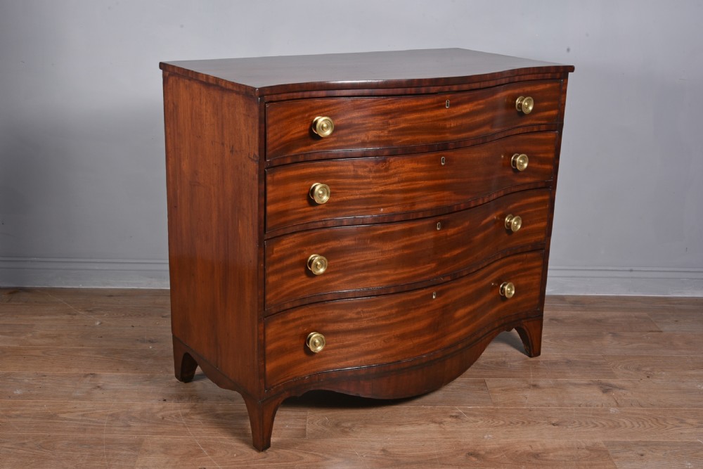 Georgian mahogany serpentine chest of drawers  View II