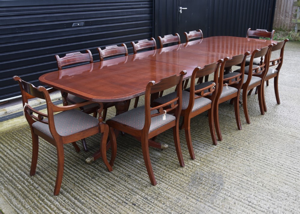 Regency style mahogany dining table and twelve chairs 