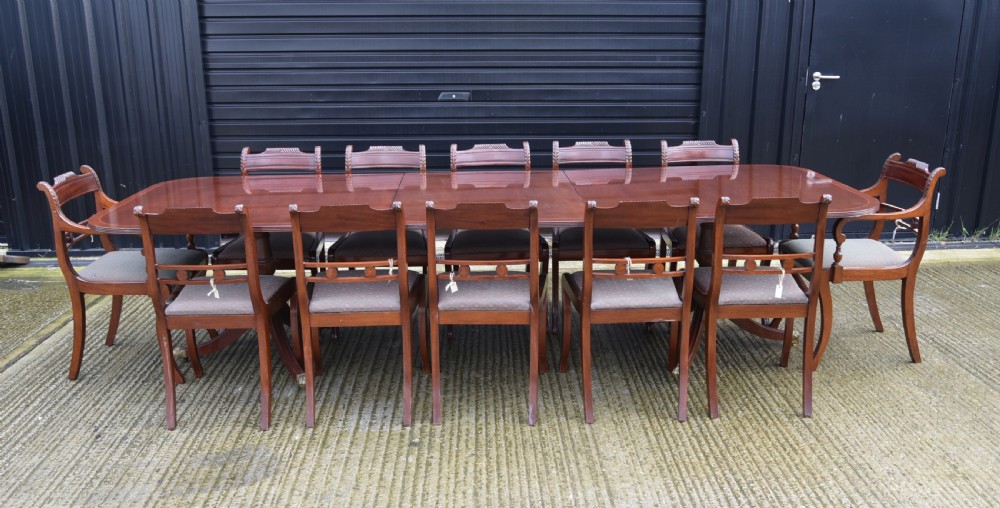 Regency style mahogany dining table and twelve chairs  View II