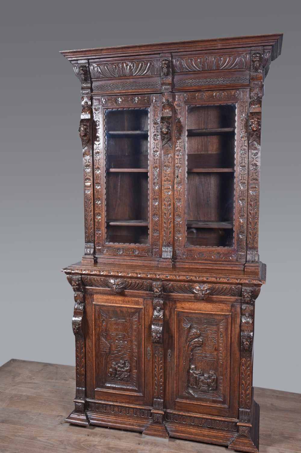 Antique Carved oak Green man two door bookcase 