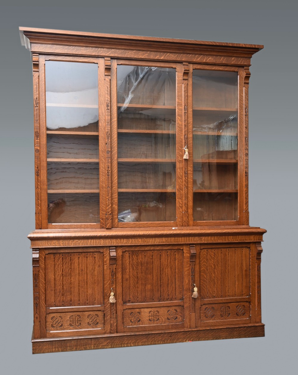 Large Arts and Crafts carved oak library bookcase 