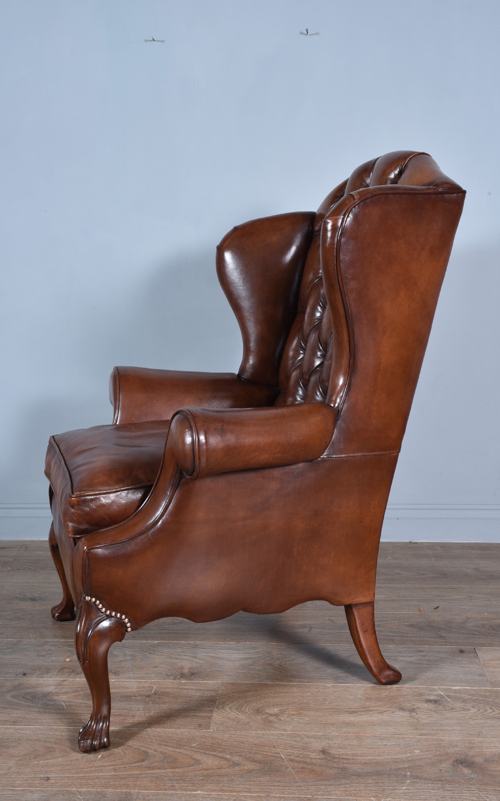 Antique leather wing chair 