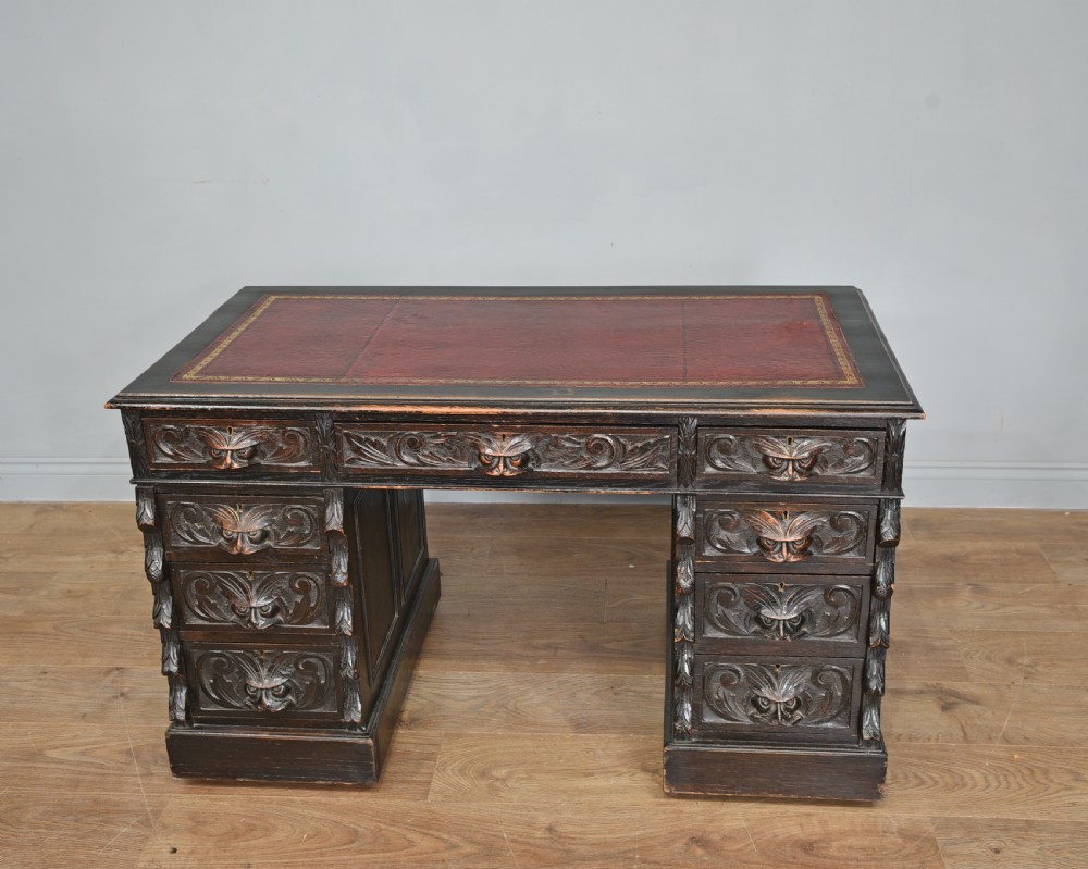 carved oak green man pedestal desk 