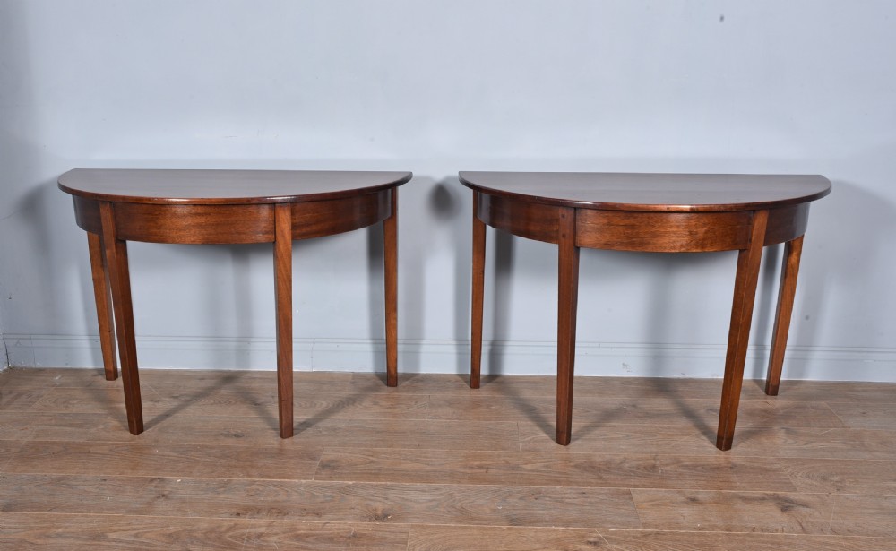 pair of Georgian mahogany Demi lune console tables  View II