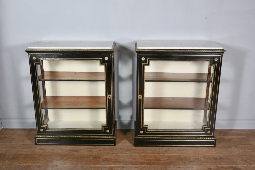 Antique pair of Regency brass inlayed marble top pier cabinets 