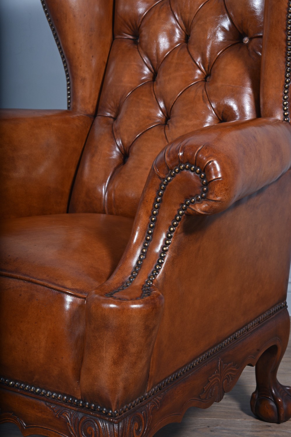 large antique deep buttoned antique leather wing chair  View IV