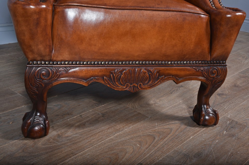 large antique deep buttoned antique leather wing chair  View V