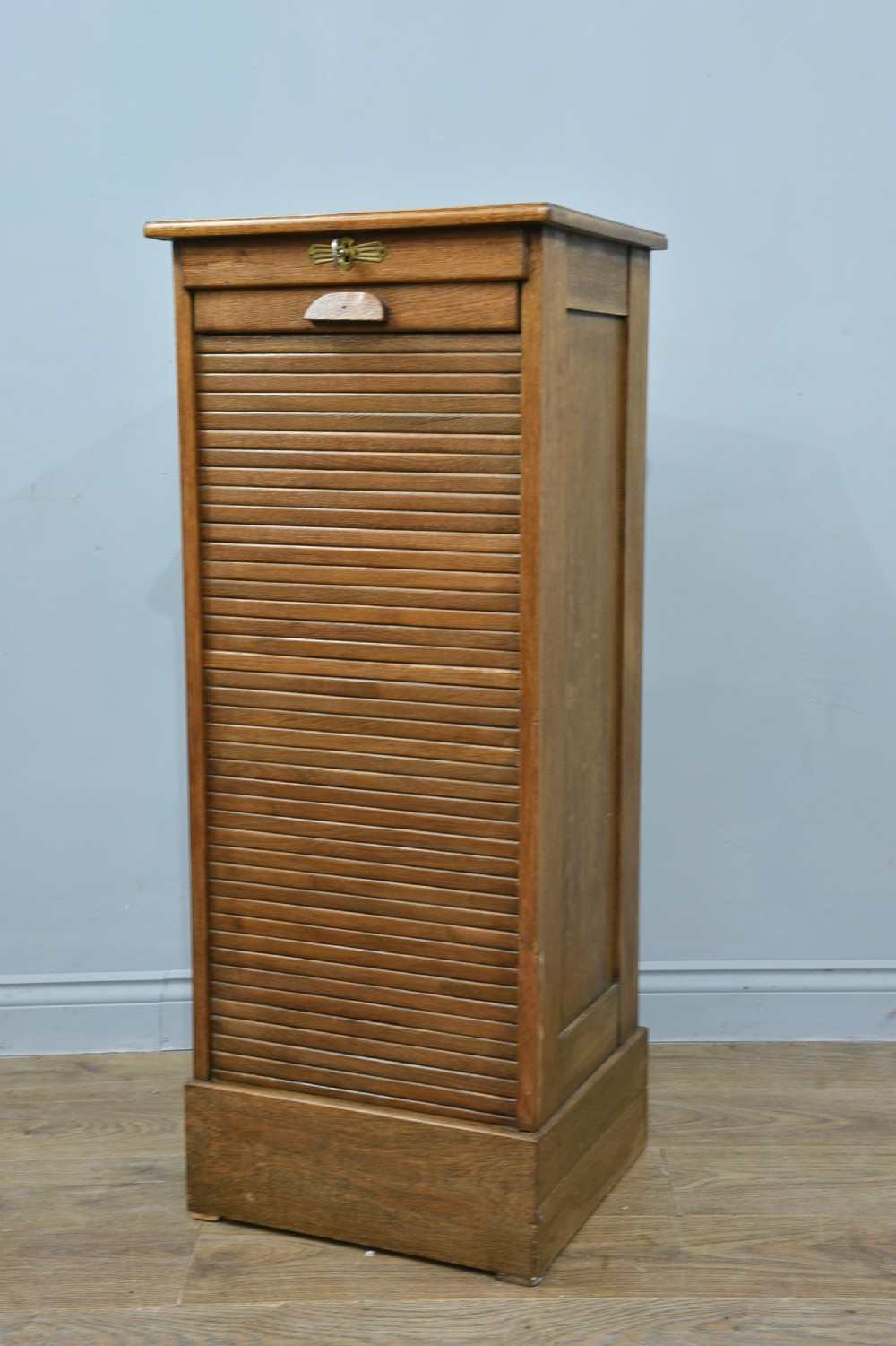 oak tambour front chest of filing drawers 