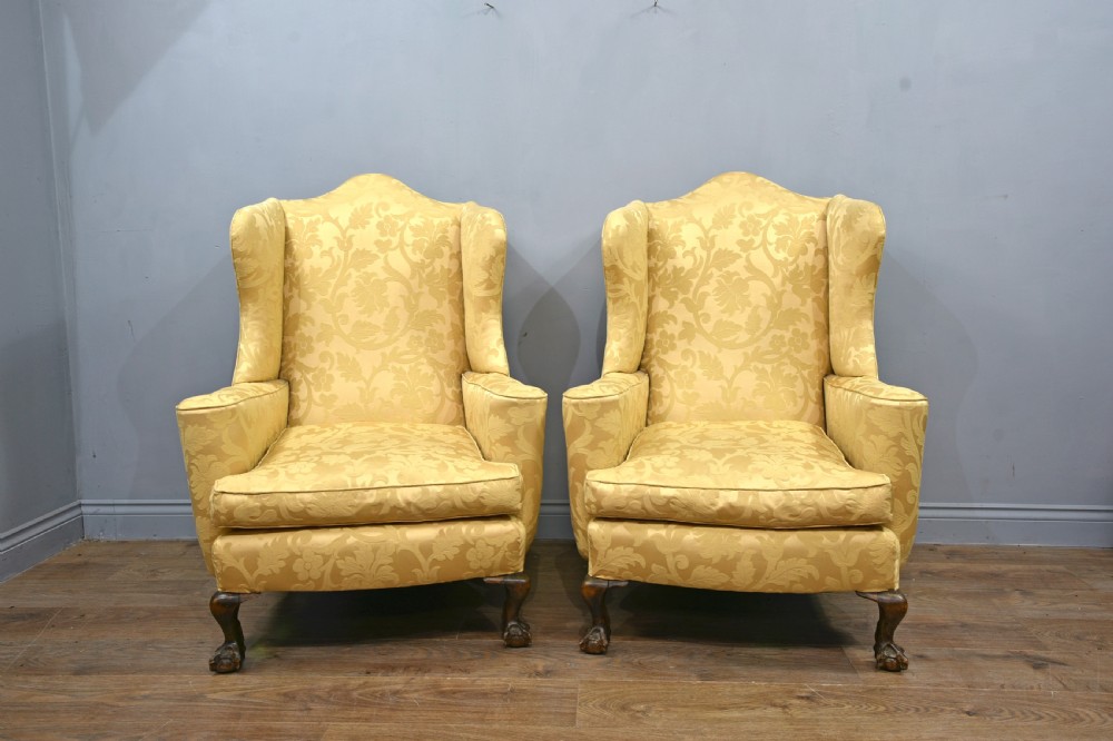 Pair of antique wing back arm chairs 