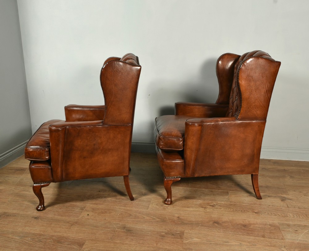 Antique pair of deep buttoned leather wing chairs  View II