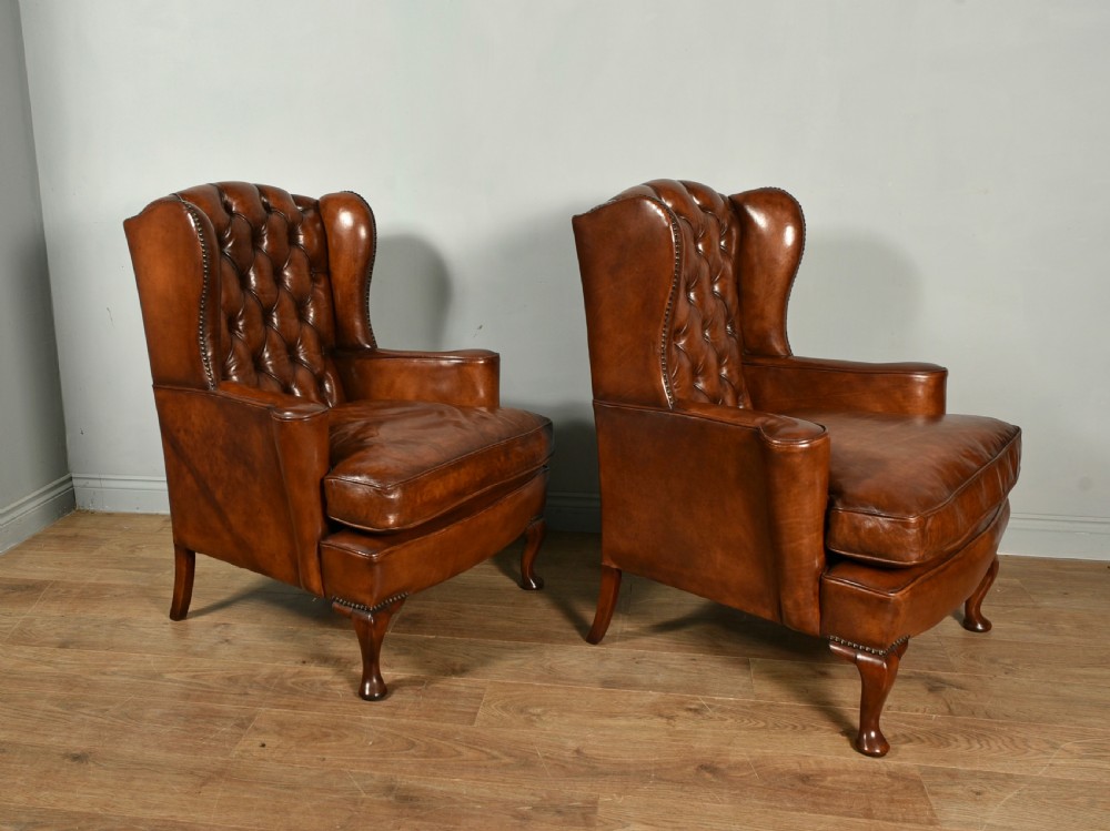 Antique pair of deep buttoned leather wing chairs  View III
