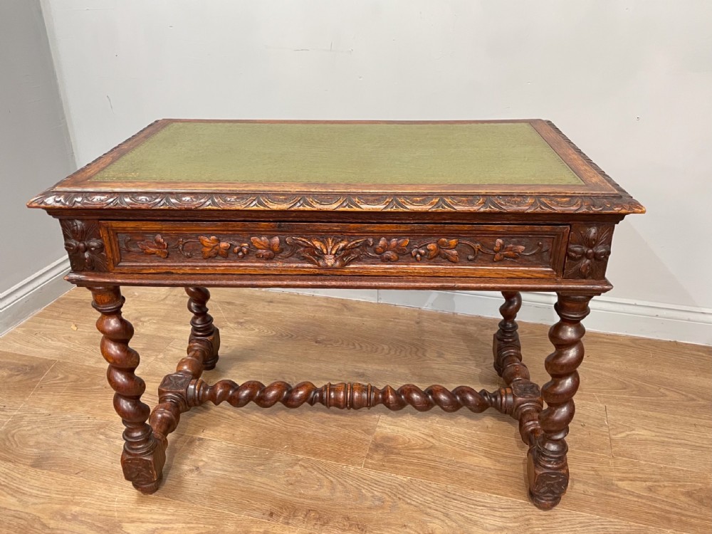 Carved oak Green man leather top desk 