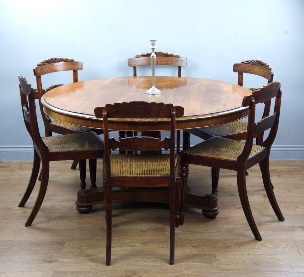 Regency rosewood dining table and six chairs 
