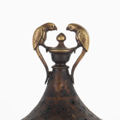fig 1. An antique Indian bronze incense burner with a pierced domed lid, twin bird top finials, and three bird-shaped tripod legs.