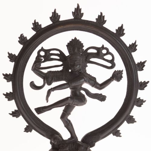 fig 1. A dark patinated bronze sculpture depicting the Hindu deity Shiva Nataraja as the cosmic dancer encircled by a flaming halo atop a tiered square pedestal.