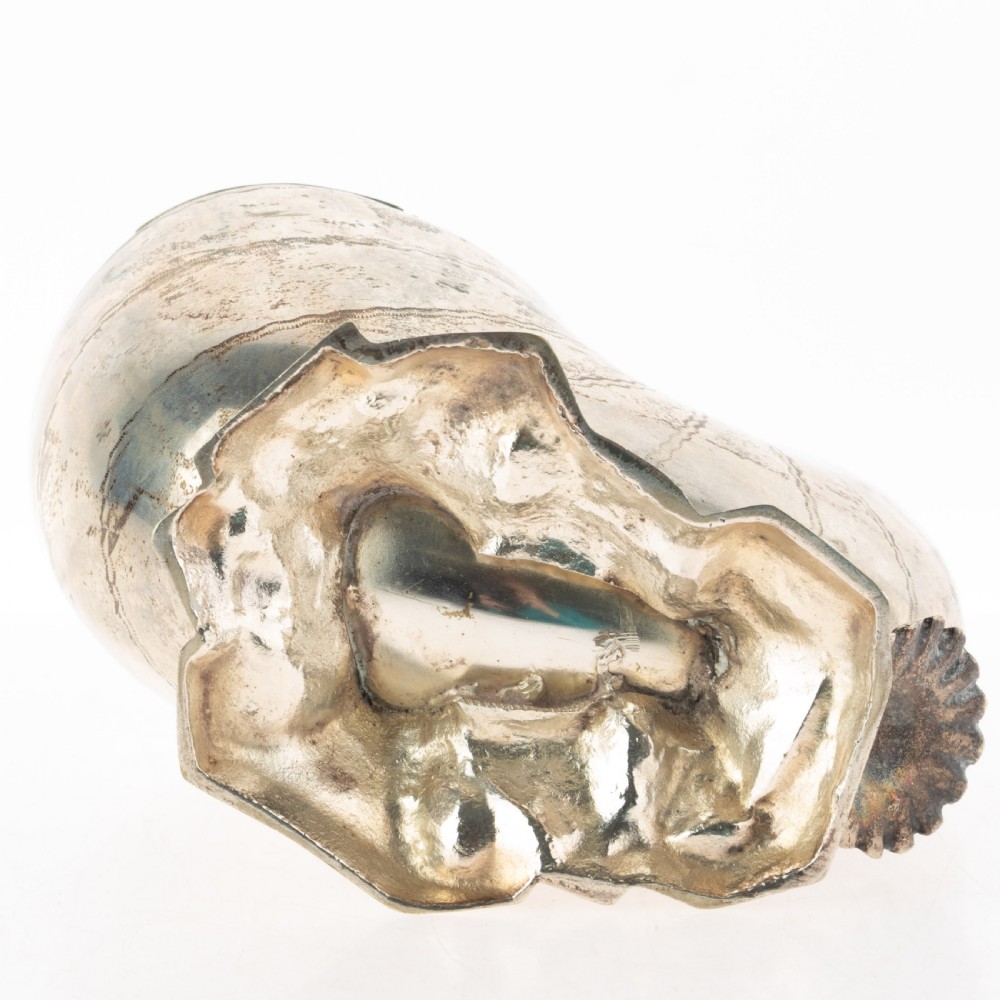 A Victorian silver-plated spoon warmer fashioned in the shape of a nautilus shell with engraved detailing and a hinged lid, resting on a textured base. View III