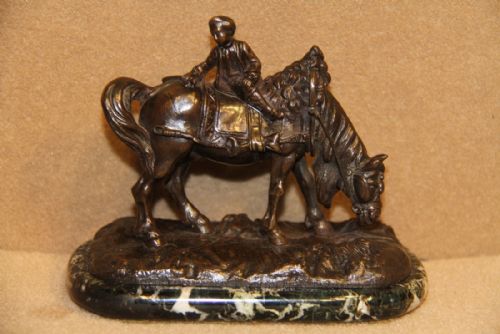A Miniature Bronze Figure of Carriage Horse