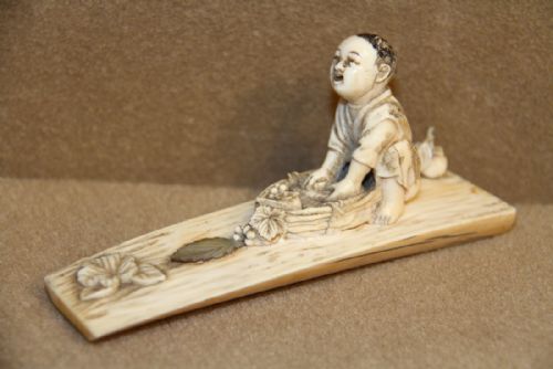 A Japanese Meiji Period Carved Ivory Okimono
