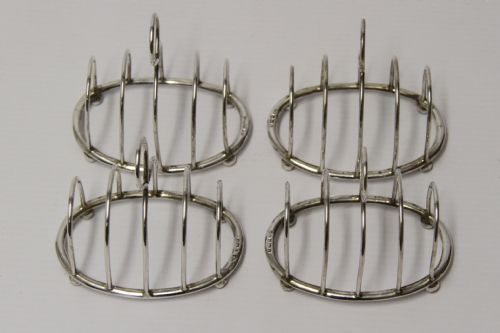 A Rare Set of Four Silver Toast Racks