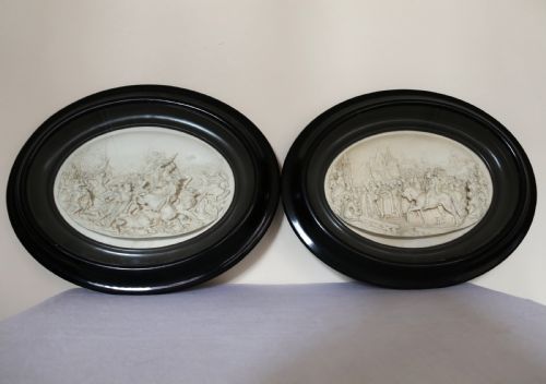 A Pair of French Oval Plaques Cast in Plaster