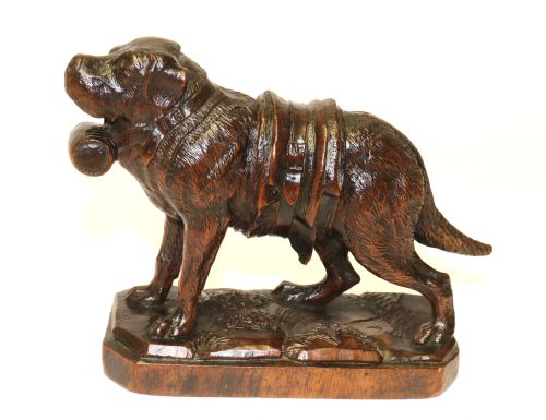 A Fine Study of a Black Forest Carved Walnut St Bernard Rescue Dog