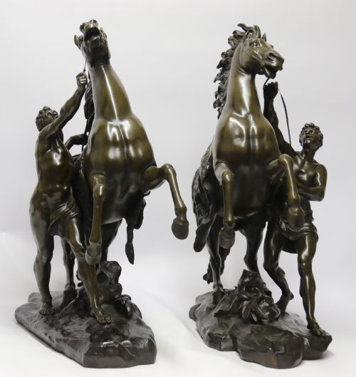 A Large Pair of Bronze Marly Horses After Costou.
