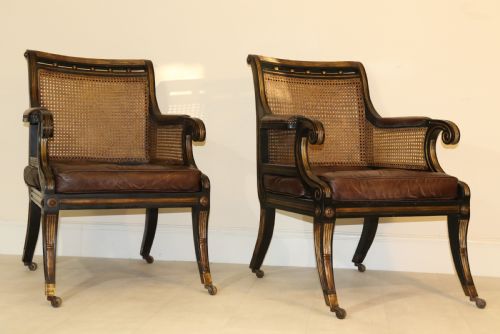 A Superb Pair of Bergère Library Chairs.