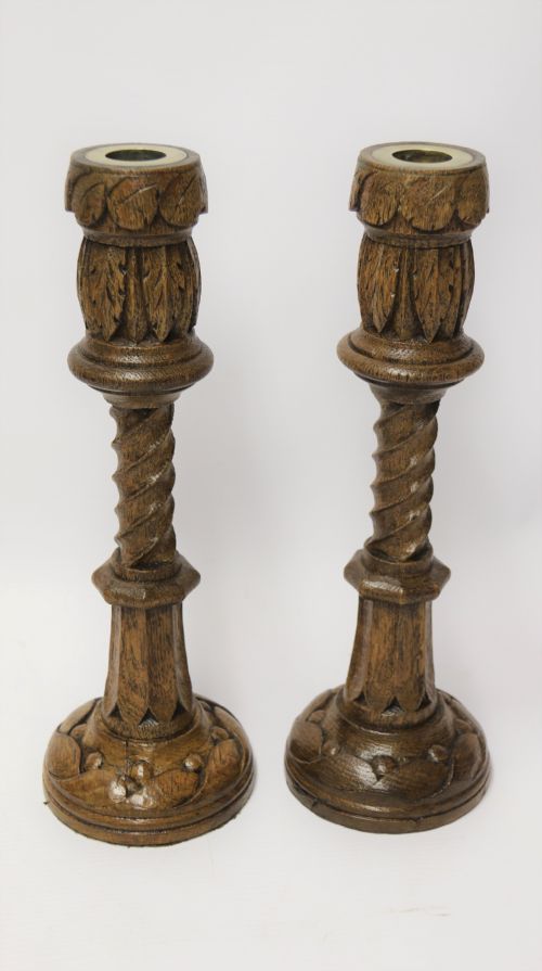 A Fine Pair of English Victorian Carved Oak Gothic Revival Candlesticks.