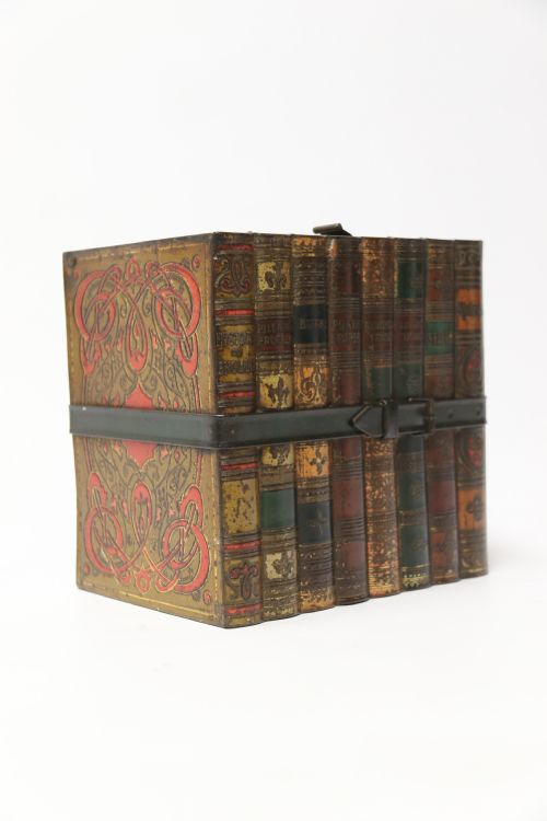 A Victorian Huntley and Palmer Biscuit Tin in the Form of a Group of Books