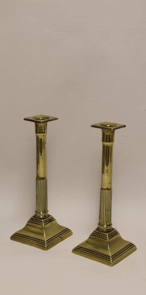 A Good Pair of English George III Brass Candlesticks.