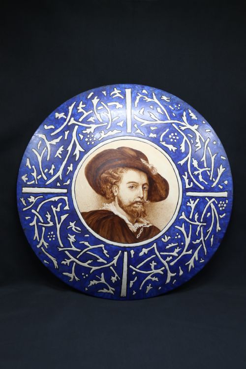 A Bold Impressive Hand Painted Continental Pottery Plaque with a Central Portrait of Rubens