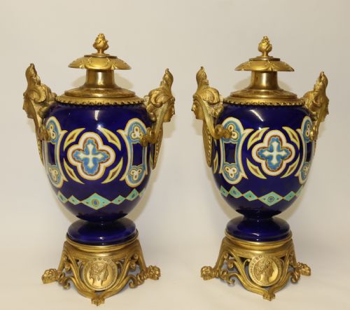 A Superb Pair of Gilt Bronze and Pottery Aztec Design Vases/ Urns