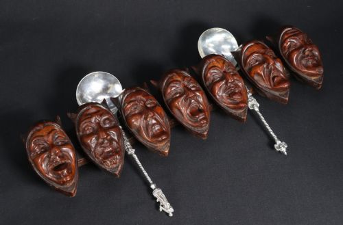A Superb Black Forest Spoon Rack Carved in the Devilish Faces of the Seven Deadly Sins.
