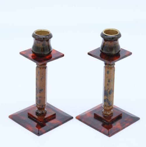 A Pair of Art Deco Tortoiseshell and Clouded Butterscotch Bakelite Candlesticks