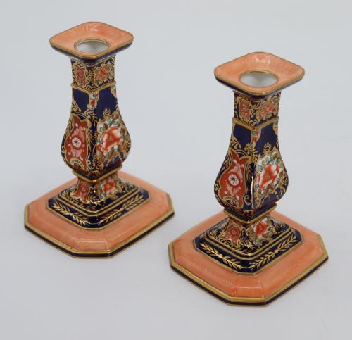 A Rare Pair of Royal Crown Derby Hand Painted Porcelain Candle Sticks.

