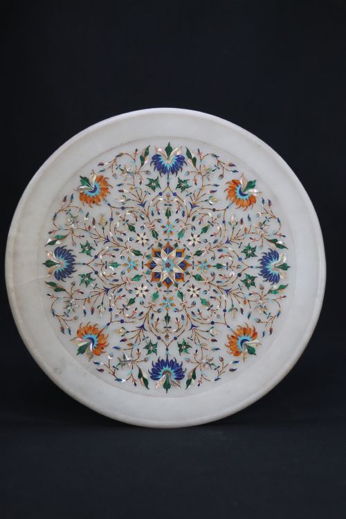 A Rare and Ultra-fine Raj Period Indian White Marble Charger Profusely Inlaid with Semi-precious Cut Stones.