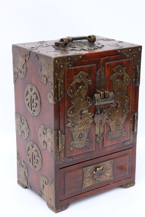A Rare Chinese Hardwood and Engraved Bronze Mounted Small Cabinet with a Makers Stamp.