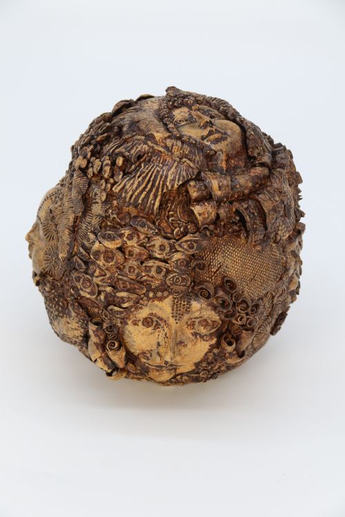 fig 1. A rare studio pottery hand created mythical sculpture of the many faces of sea urchins.