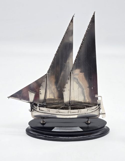 fig 1. An important silver Royal military presentation boat from the palace staff to the Governor of Malta, Sir Robert Laycock Major General KCMG CB DSO KStJ