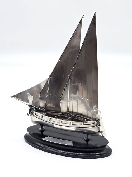 fig 2. An important silver Royal military presentation boat from the palace staff to the Governor of Malta, Sir Robert Laycock Major General KCMG CB DSO KStJ