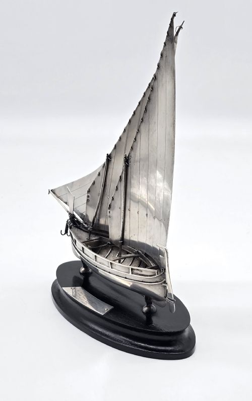 fig 3. An important silver Royal military presentation boat from the palace staff to the Governor of Malta, Sir Robert Laycock Major General KCMG CB DSO KStJ