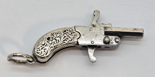 fig 2. A superb pocket watch chain fob in the form of a flintlock pistol

