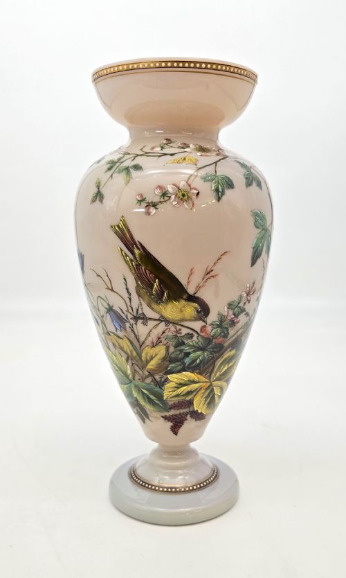 fig 1. A Victorian opalescent blush pink glass urn vase decorated with hand-painted enamel illustrations of a songbird, delicate blossoms, and gilt trim along the flared rim and base.